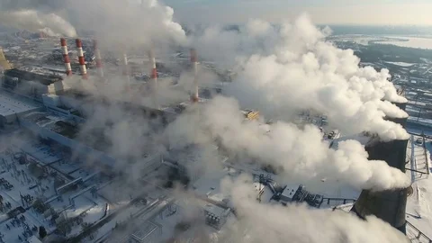 Air pollution concept. Power plant with smoke from chimneys. Drone shot Stock Footage