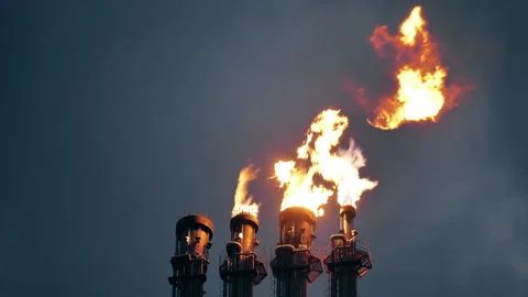Air pollution concept. Refinery flare stacks with fire caused by gas combustion Stock Footage 163508936