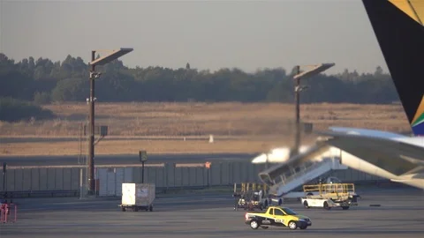 Air pollution from jet engine driving in reverse on Airport Stock Footage 119501516