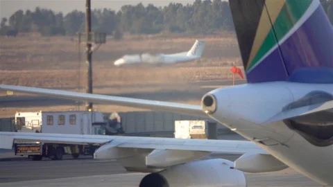 Air pollution from jet engine driving on Runway Stock Footage 119502524