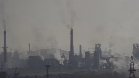 Air pollution over the city by industrial plant emissions Stock Footage