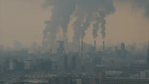 Air pollution by smoke coming out of factory chimneys Stock Footage