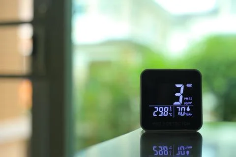 Air quality sensor placing on a table indoor. sensor found small amount of ai Stock Photos