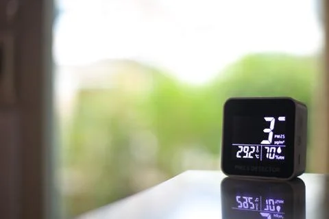 Air quality sensor placing on a table indoor. sensor found small amount of ai Stock Photos