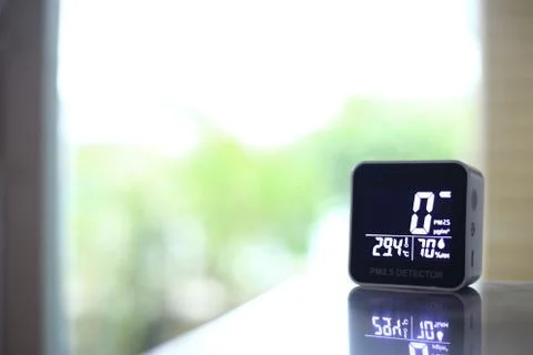 Air quality sensor placing on a table indoor. sensor found small amount of ai Stock Photos
