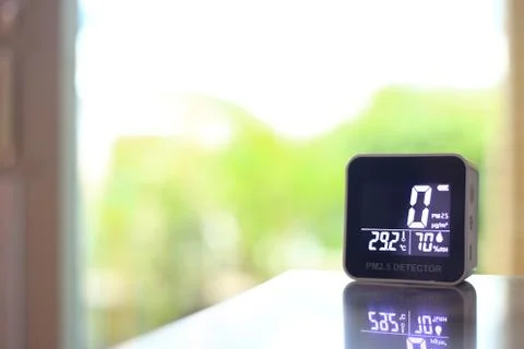 Air quality sensor placing on a table indoor. sensor found small amount of ai Stock Photos