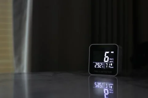 Air quality sensor placing on a table indoor. sensor found small amount of ai Stock Photos