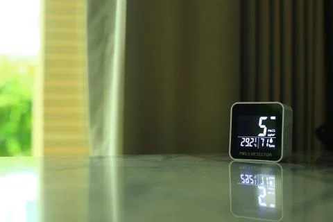 Air quality sensor placing on a table indoor. sensor found small amount of ai Stock Photos