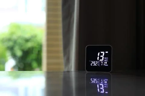 Air quality sensor placing on a table indoor. sensor found small amount of ai Stock Photos