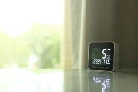 Air quality sensor placing on a table indoor. sensor found small amount of ai Stock Photos