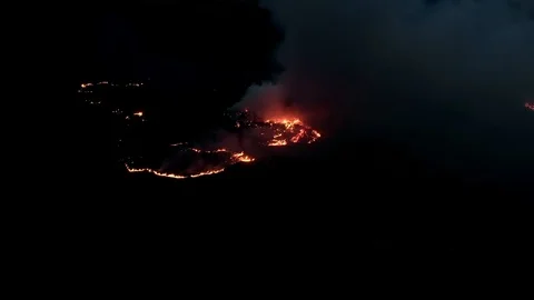 Air shot, of fire flame in the dark night . A terrible dangerous wild fire at Stock Footage 127291818