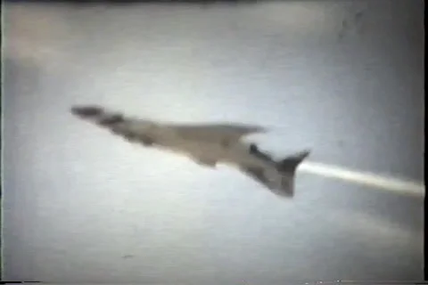 Air show single jet flies upside down past crowd, early 1960's Video stock 36086690