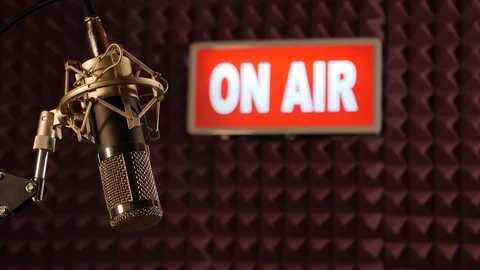 On Air sign lighting up in TV Studio, Radio Station. microphone in front Stock Footage