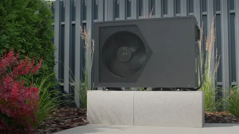 Air source heat pump heating system installed in garden of modern residenti.. Stock Footage 334991674