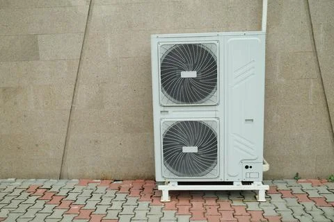 Air source heat pump installed in building. Sustainable and clean energy Fotos de archivo