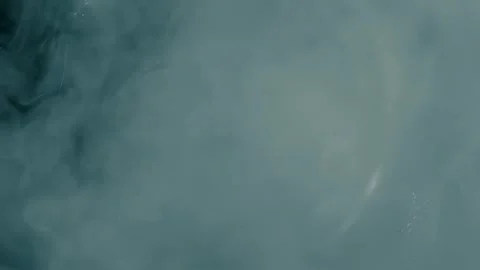 The air stream blows the layer of smoke, creating a spectacular funnel Stock Footage 313207766