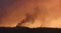 Air tankers fly above ferocious fire time lapse HD Footage
