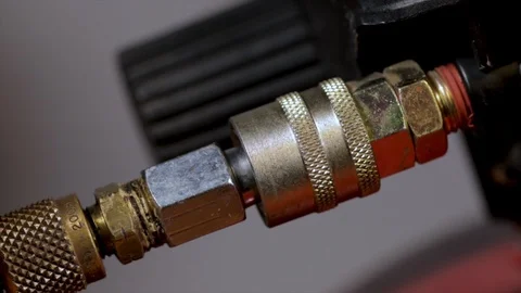 Air tools close up hand plugging into a an air compressor. Workshop machinery ru Video stock 120576757