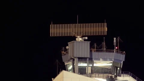 Air traffic control radar on tower rotating at night Stock Footage 221270078