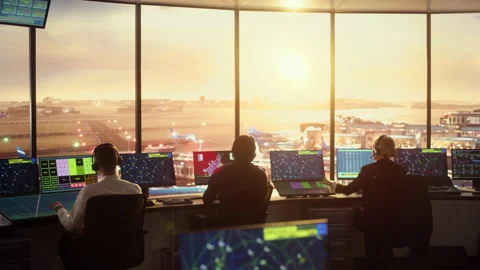 Air Traffic Control Team Works in Airport Tower at Sunset Stock Footage 151917143