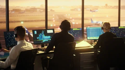 Air Traffic Control Team Works in Airport Tower at Sunset Stock Footage 151918843