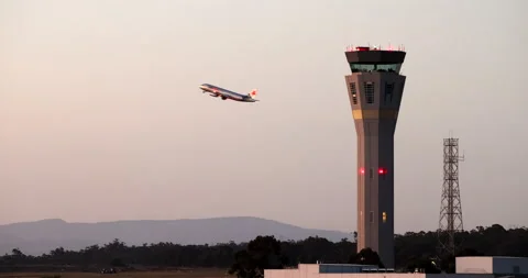 Air Traffic Control Tower at Melbourne Airport with aircraft taking off. Stock Footage 155090154