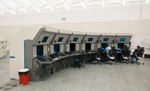 Air Traffic Controllers in air traffic control center with monitors and radar Stock Photos