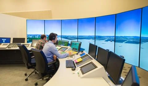 Air Traffic Controllers in air traffic simulator center with monitors and rad Stock Photos