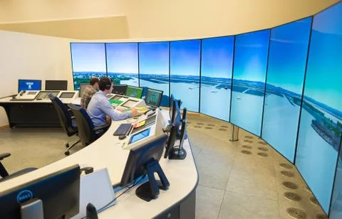 Air Traffic Controllers in air traffic simulator center with monitors and rad Stock Photos