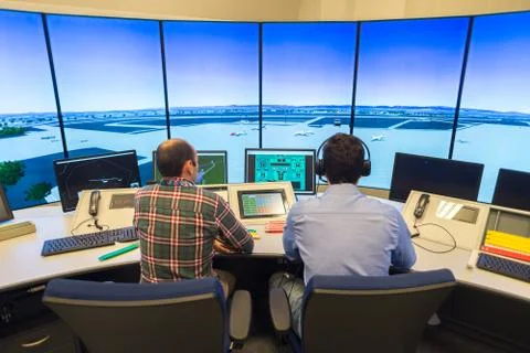 Air Traffic Controllers in air traffic simulator center with monitors and rad Stock Photos