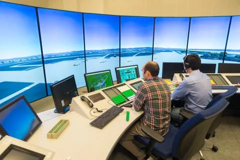 Air Traffic Controllers in air traffic simulator center with monitors and rad Stock Photos