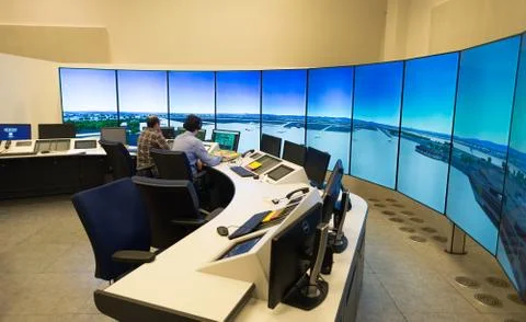 Air Traffic Controllers in air traffic simulator center with monitors and rad Stock Photos
