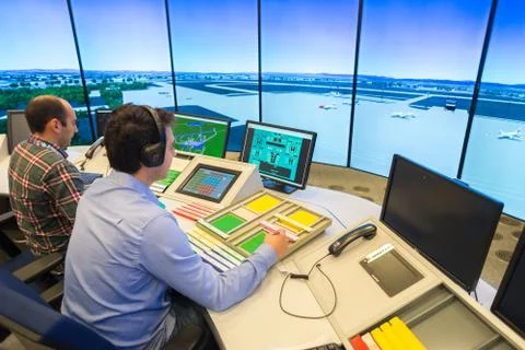 Air Traffic Controllers in air traffic simulator center with monitors and rad Stock Photos