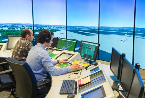 Air Traffic Controllers in air traffic simulator center with monitors and rad Stock Photos
