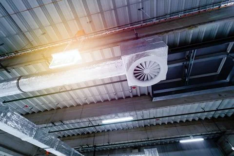 Air ventilation system on the ceiling in a large warehouse Stock Photos
