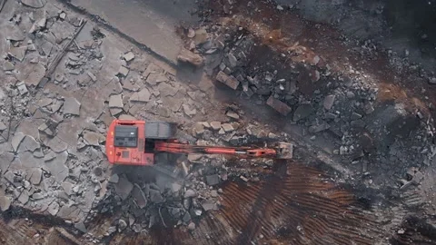 Air view. Demolition work is carried out with the help of an excavator. Heavy Video stock 144465754