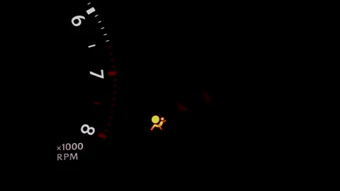 Airbag SRS warning indicator light on dashboard of a car. Stock Footage 136100741