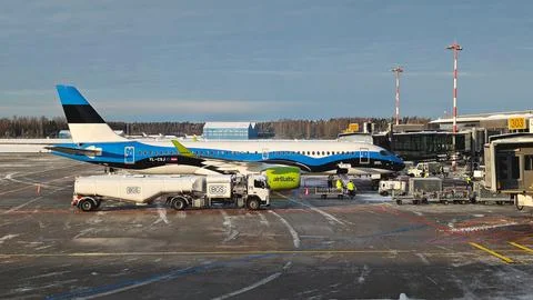 AirBaltic aircraft loading baggage at Riga International Airport in Latvia Stock Photos