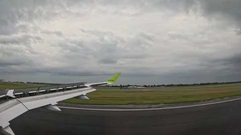 AirBaltic airplane decelerating on runway after landing Stock-Footage 340320575