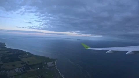 AirBaltic flight view over Danish coastline and Oresund Strait at twilight Stock Footage 340183756