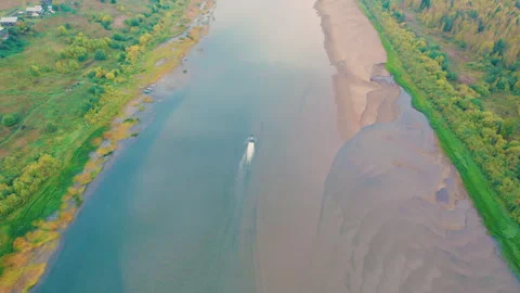 The airboat rushes down the river. An inflatable flat-bottomed vessel. Stock Footage 294790927