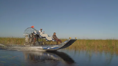 Airboat speeding through the Florida Everglades Stock Footage 94642353