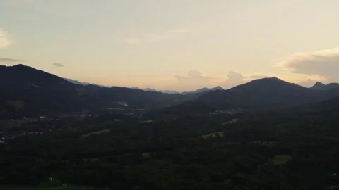 Airborne ascending upward flying view of large river with mountainous landscape Stock Footage 330051533