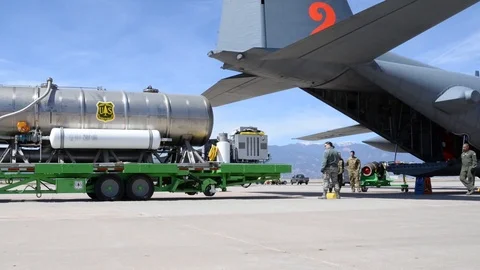 Airborne Fire Fighting System unit loaded on a C-130 Hercules Stock Footage 114084829