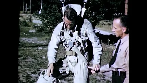 Airborne firefighters practice let down rope procedures for parachute landing on Stock Footage 107737953