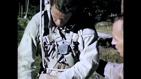 Airborne firefighters practice let down rope procedures for parachute landing on Stock Footage 107737981
