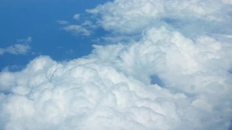 Airborne view of puffy clouds from above Video stock 57155376
