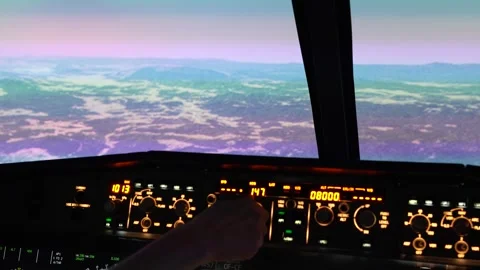 Airbus A320 cockpit view - pilot adjusts controls, flight simulation 스톡 동영상 312672780