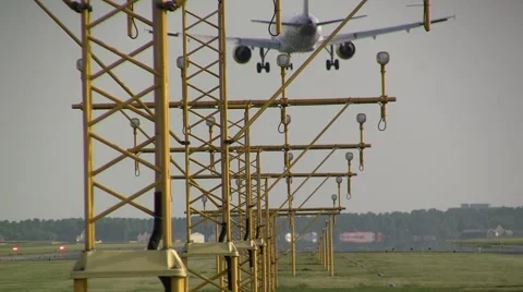 Airbus landing with lamp posts in the front Stock Footage 4888081