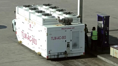 Aircraft Air Conditioning Unit (ACU) is filling fuel at airport gas station. Stock Footage 304528248